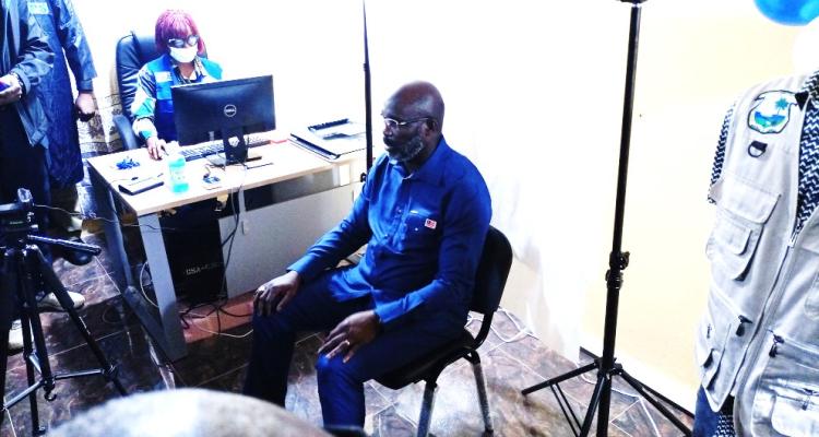 President Weah was photographed for an instant driver’s license card.