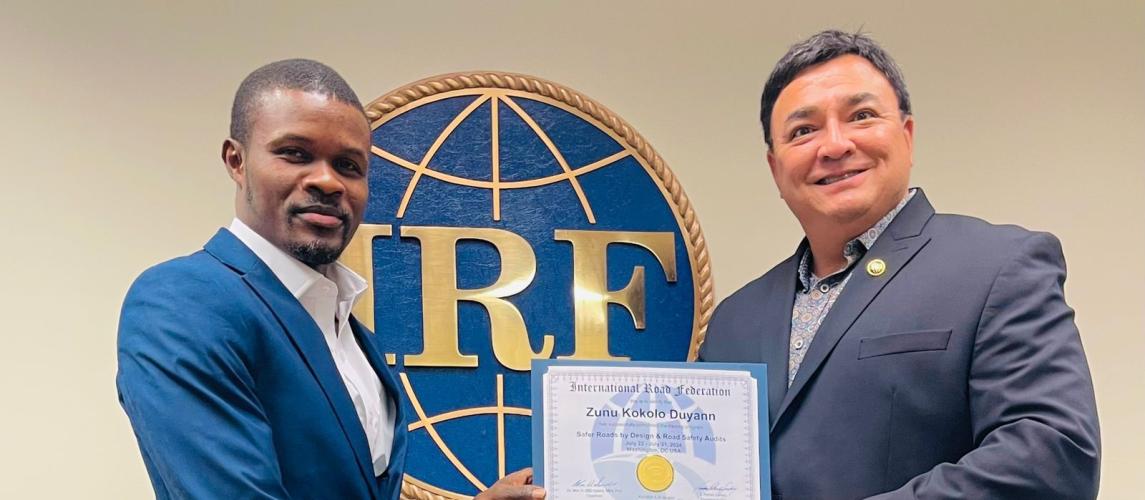 Assistant Minister receiving his certificate