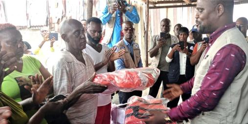 Deputy Transport Minister, J. Darious Kollie presenting the items